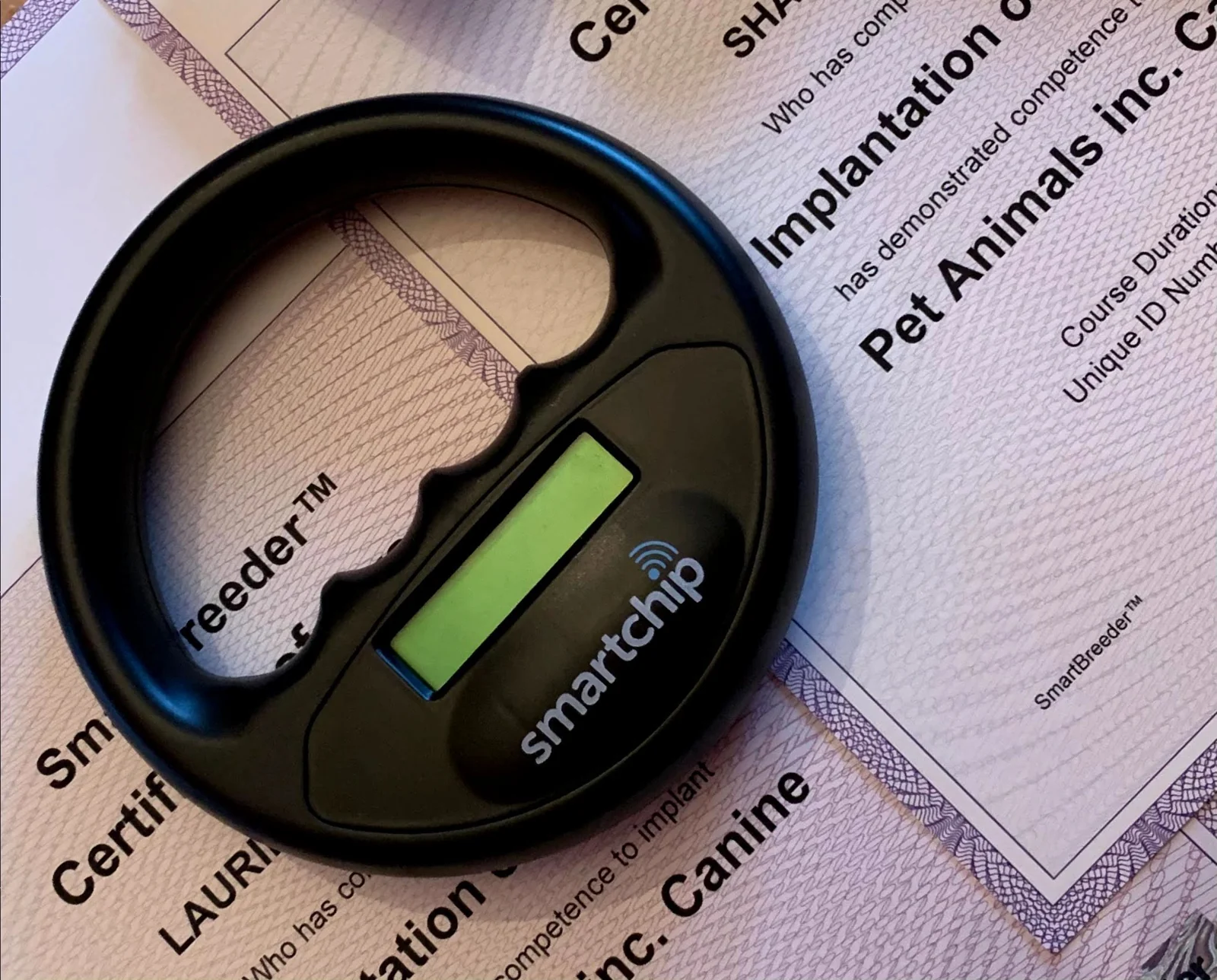 Pet microchip scanner and registration certificate used by Tails of Gloucester